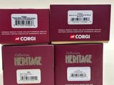three boxes of corgi heritage coffee sitting on a white surface