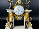 a clock that is sitting on top of a table
