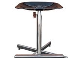 a close up of a stool on a metal stand with a black seat