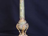 an antique lamp with a green marble base and gold accents