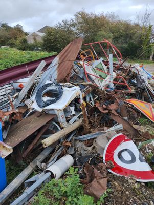 a pile of junk sitting on the side of the road