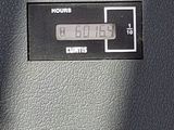 a close up of a clock on the side of a car