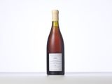 a bottle of wine sitting on a table
