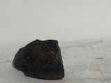 a piece of rock that is sitting in the snow