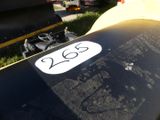 a close up of a motorcycle with a number plate on it