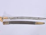 two different types of knives on a white surface