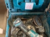 a blue box with tools inside of it on the floor