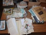 a table with a lot of books and papers on it