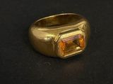 une image représentant une bague en or ornée d'une citrine au centre