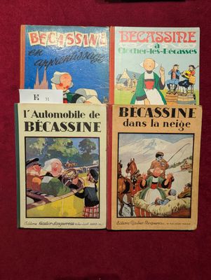 trois livres posés sur une table rouge