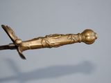 a gold sword with a gold handle on a blue background