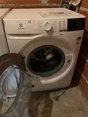 a washer and a dryer in a small room