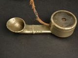 a pipe that is sitting on a black surface