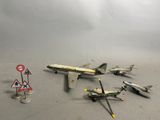 a lot of toy airplanes that are sitting on the floor