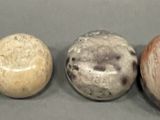three different types of rocks sitting on a table next to each other