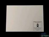 a close up of a piece of white paper on a black background