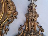 two clocks on the wall next to each other