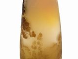 yellow and brown glass vase on white background with clouds in the sky