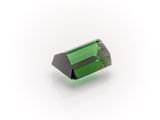 a green tourmaline gems on a white background