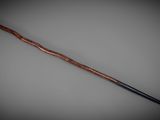 a close up of a cane with a wooden handle on a gray background