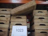 many wooden crates stacked on top of each other in a store
