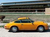 a yellow car that is parked on the side of the road