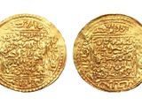 a close up of two gold coins on a white background