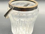 a glass cup with a handle on a table