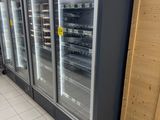 two refrigerators that are in the middle of a room