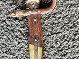 a close up of a knife on a carpet