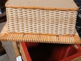two wicker baskets stacked on top of each other on a table