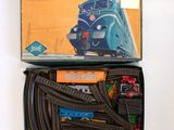 a box with a train set in it on a table