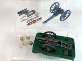 a display case with a gun, rifle, and other items on it