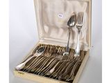 silverware in a case with spoons, forks and spoons