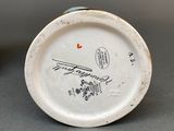 a white plate with a picture of a train on it