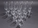 many empty wine glasses lined up on the table