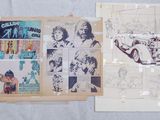 several pages of comics are on display on a table