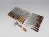 several different types of knives are lined up on a white surface
