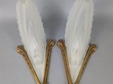 pair of art deco sconces in the form of a pair of wings