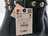 a close up of a pair of boots with a price tag on it