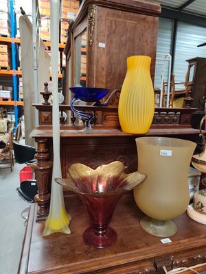 many different vases on a table in a store