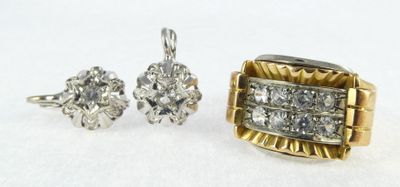 a close up of two rings and a pair of earrings