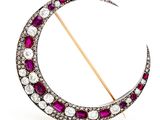 an antique ruby and diamond crescent broochle