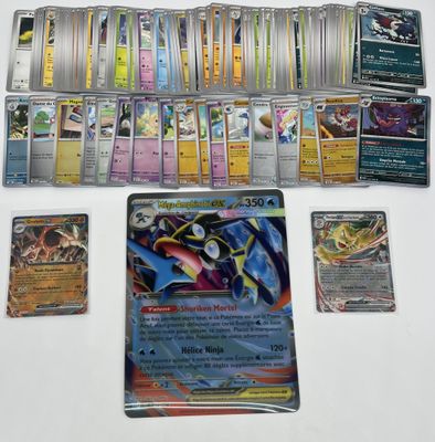 a lot of pokemon cards on the table