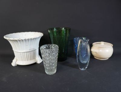 many different vases and bowls sitting on a table