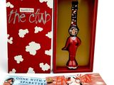 the cup is in a red box with a picture of a woman holding a wine glass