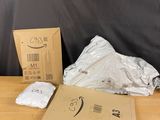 a box of white towels sitting on top of a wooden table