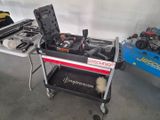 a small cart with tools on it in a garage