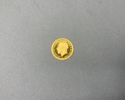 gros plan d'une pièce d'or sur laquelle figure un homme