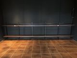 an image of a room with a bench and a wall